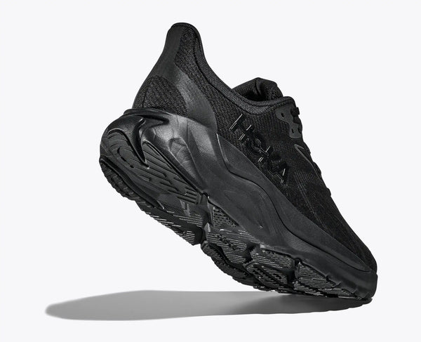 An all black womens hoka running shoe on a white background
