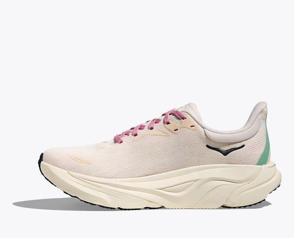 White running shoe with pink laces on a white background