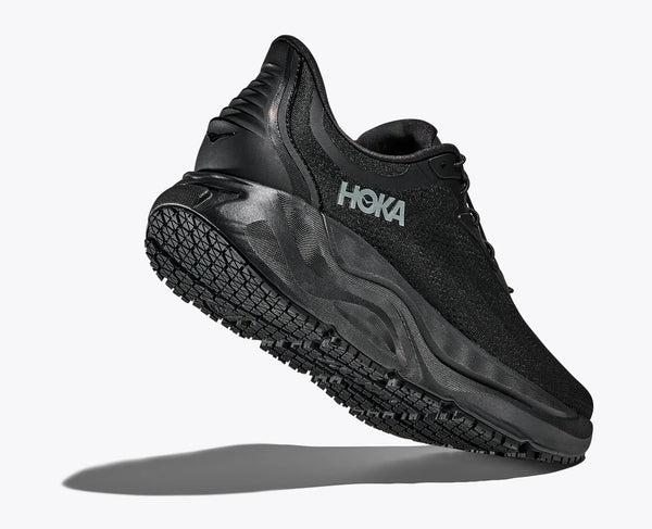 Close-up of an all-black Hoka running and walking shoe on a white background