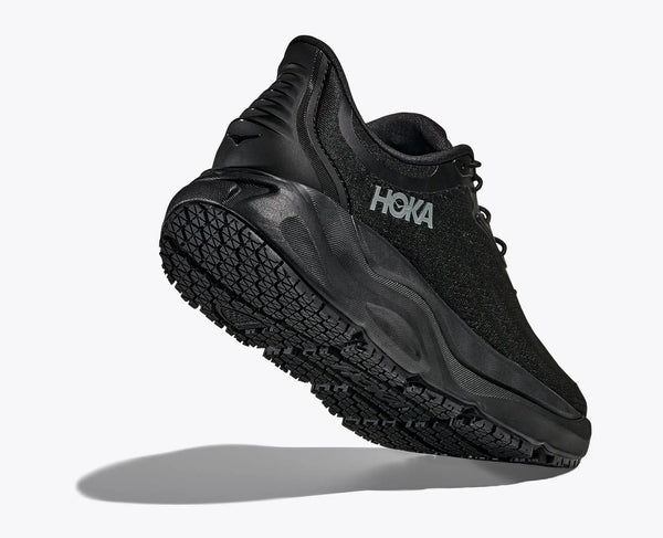 Black Hoka running shoe on a white background
