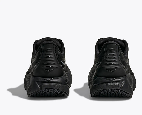 Black athletic shoes shown from the back on a white background