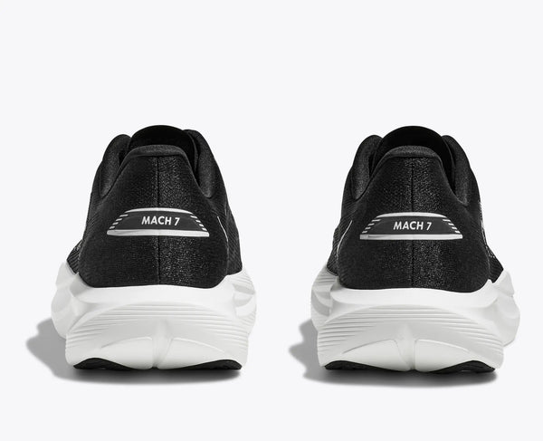 The heel of these running shoes has the model name "mach 7" written horizontally on the heel.