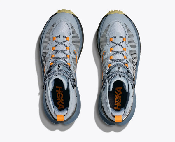 Pair of gray and orange Hoka running shoes on a white background