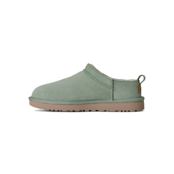 Light green ugg slipper on a white background