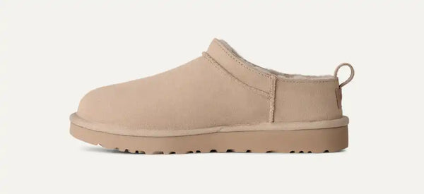 Very light tan Ugg slipper on a white background