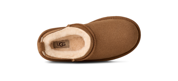 Kids ankle length tan slipper boot on a white background