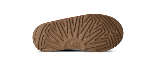 Kids ankle length tan slipper boot on a white background