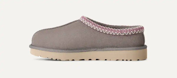 Grey, pink, and tan slipper on a white background