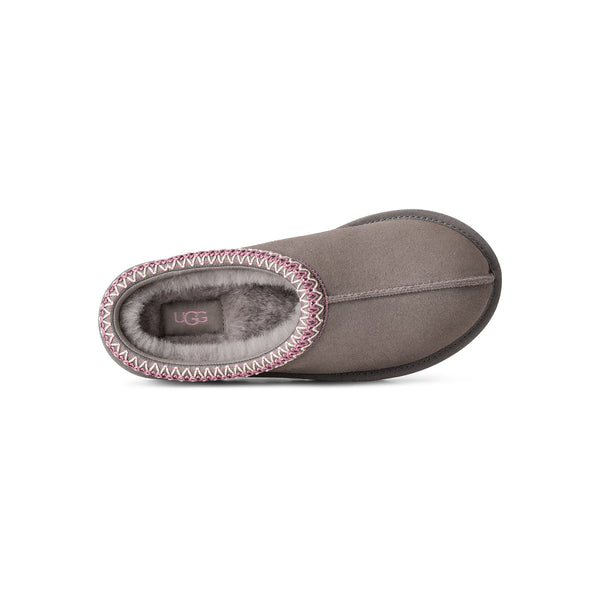 Grey, pink, and tan slipper on a white background