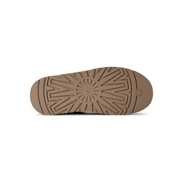 Deep green ugg slipper on a white background