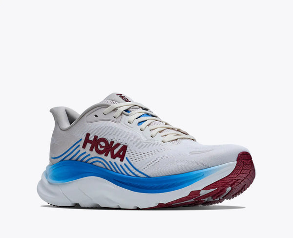 White running shoe with blue sole and red accents on a white background
