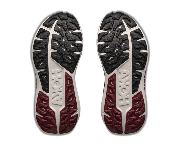 Burgundy and white trail running shoe on a white background