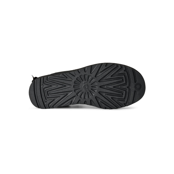 Black ankle length slipper boot with bow on the back