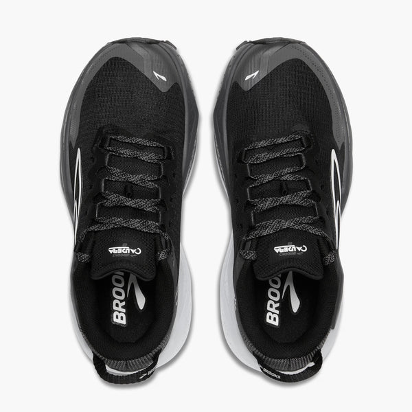 Black running shoes with visible branding on a white background