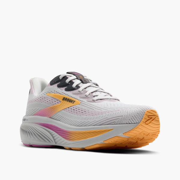 White running shoe with colorful sole on a white background
