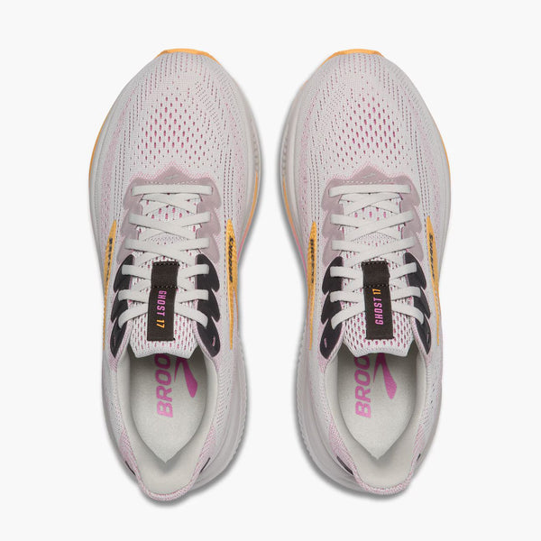 White running shoes with black and pink accents on a white background