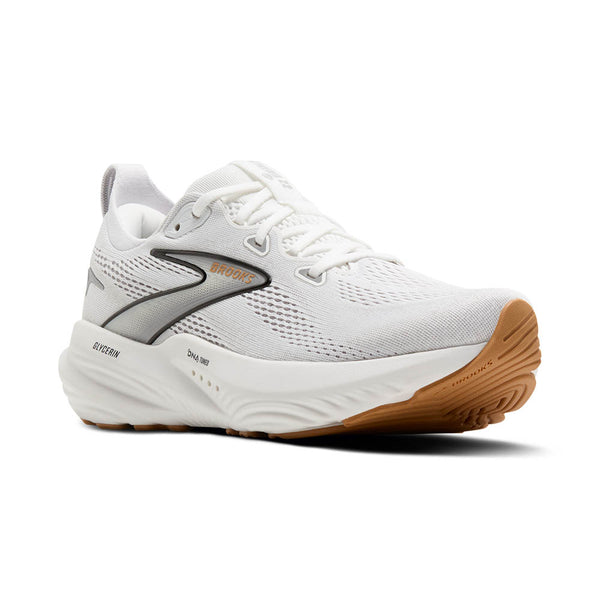 White running shoe with brown sole on a white background