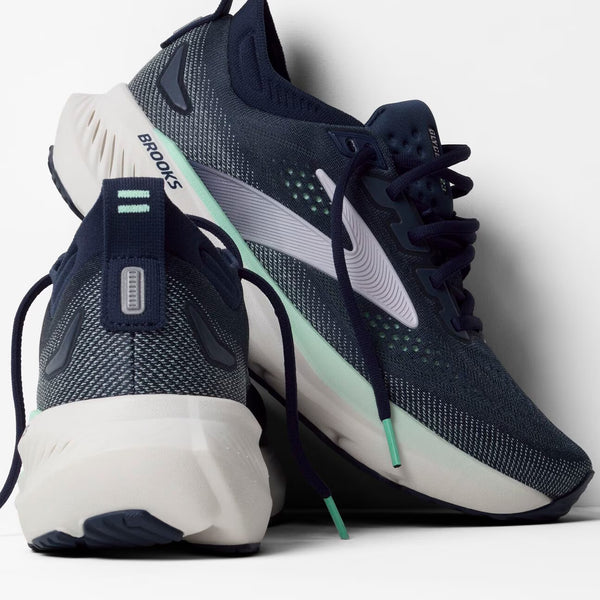 Teal running shoe on a white background