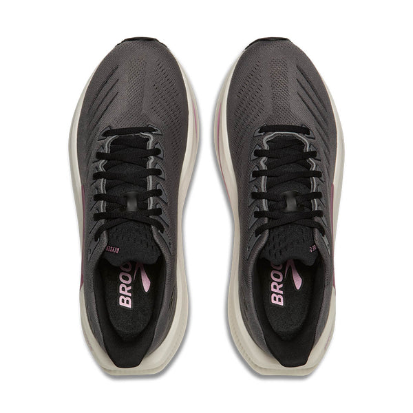 Pair of gray running shoes with black soles on a white background