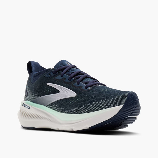 Navy running shoe with white sole on a white background