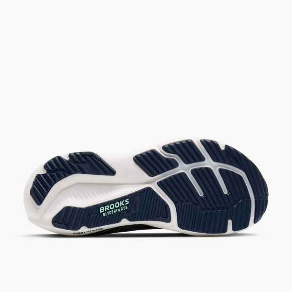 Navy and white running shoe with 'Brooks' branding on a white background