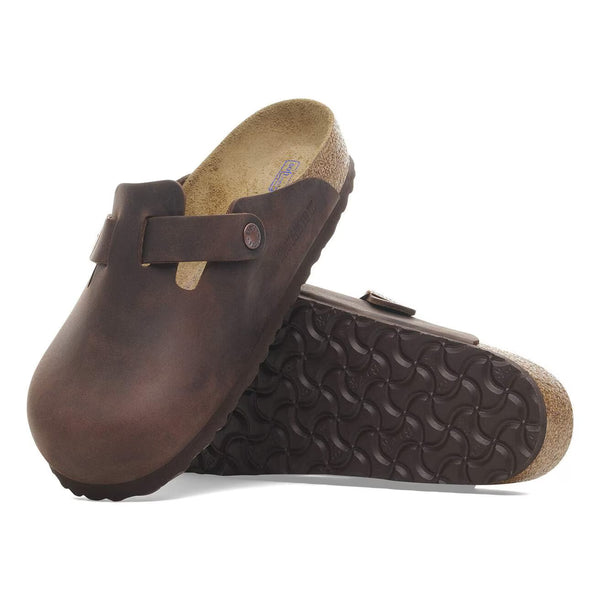 Deep brown leather clog on a white background