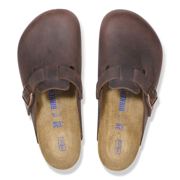 Deep brown leather clog on a white background