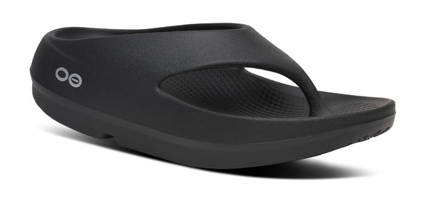 Chunky black thong sandal on a white background