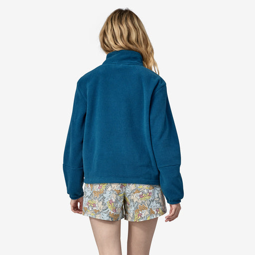 Backview of woman modeling 1/2 zip fleece