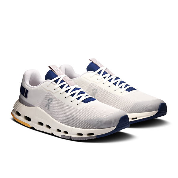 White and blue athletic shoes on a white background