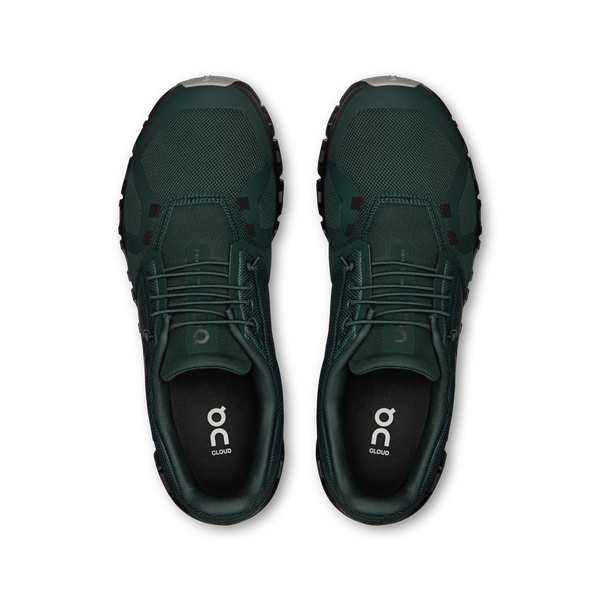 Pair of green athletic shoes on a white background