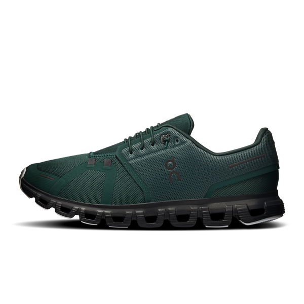 Green running shoe with black sole on a white background
