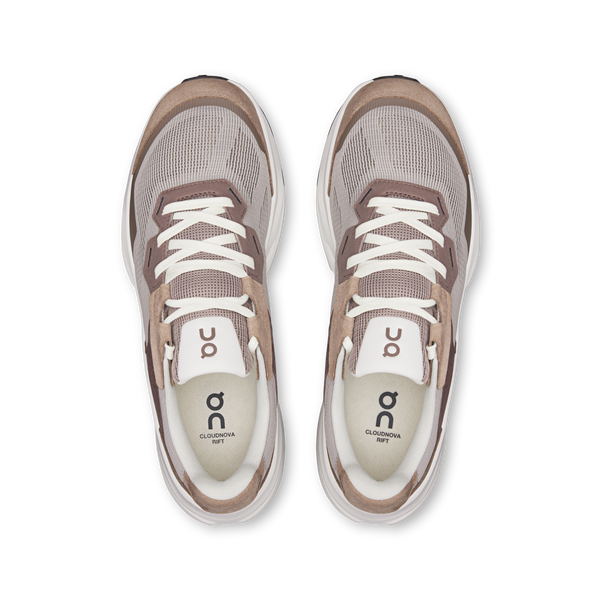 Pair of gray sneakers with white laces on a white background