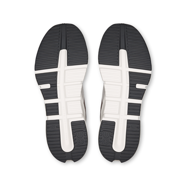 Top view of black and white shoe soles on a white background