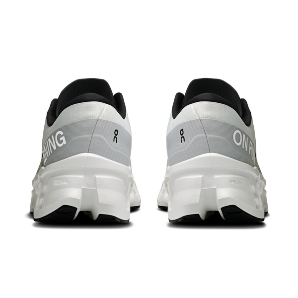 White running shoes with black soles on a white background