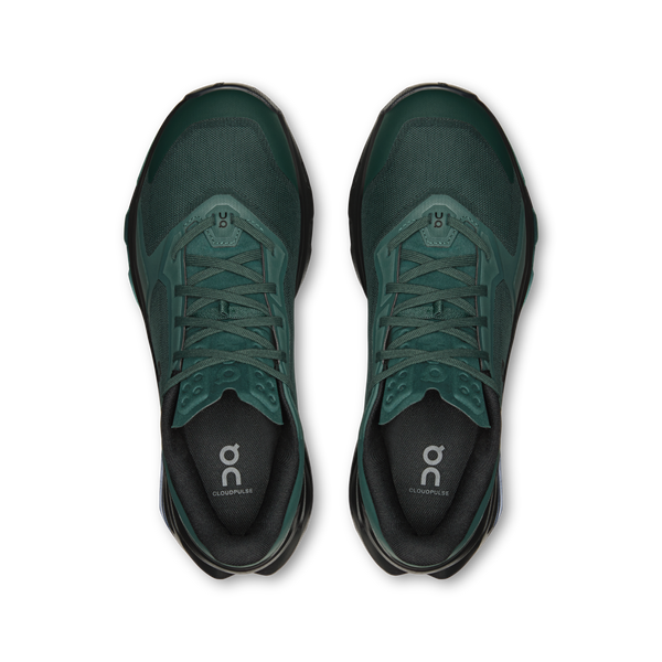 Pair of green running shoes on a white background