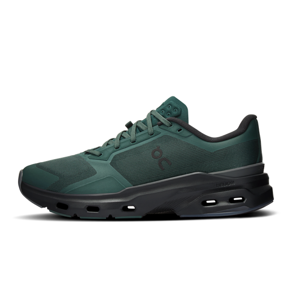 Green athletic shoe with black sole on a white background