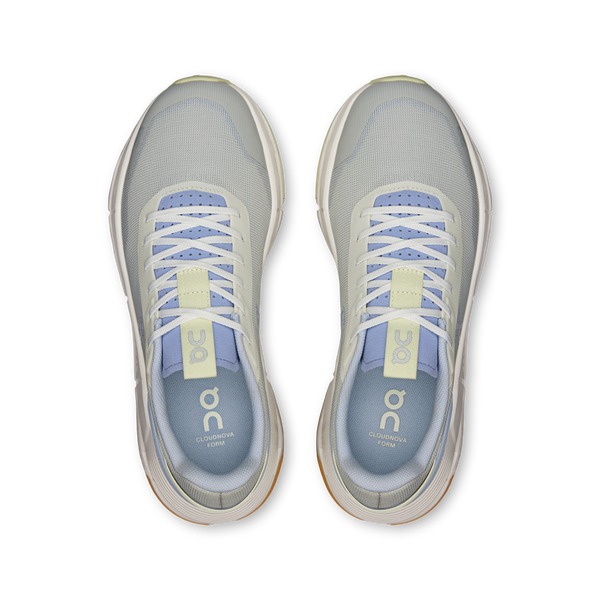 Pair of gray running shoes with white soles on a white background