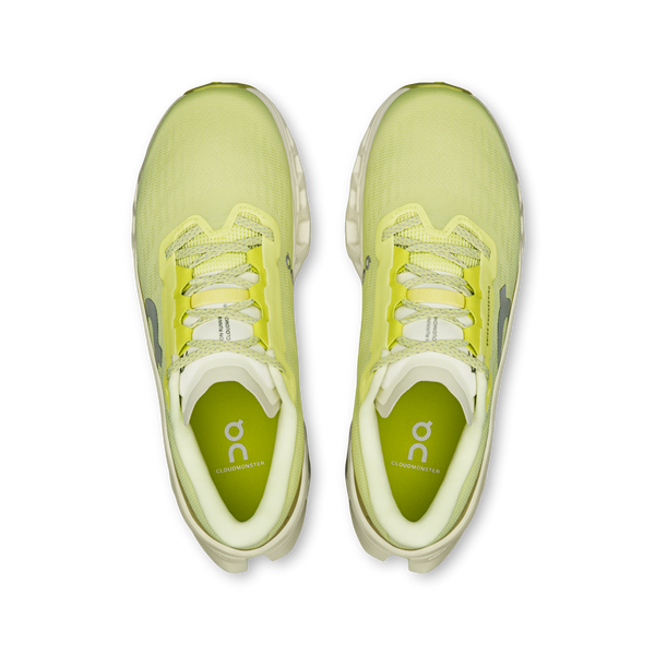 Pair of light green running shoes on a white background