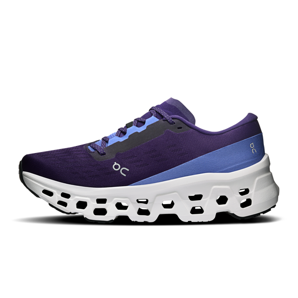 Purple and blue running shoe with white sole on a white background