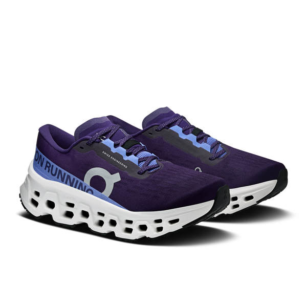 Purple running shoes with white soles on a white background