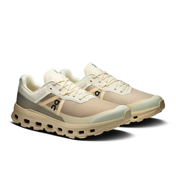 Beige and white sneaker with brand logo on a transparent background