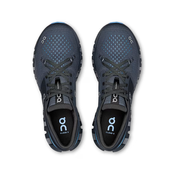 Pair of dark gray running shoes with 'on' branding on a white background