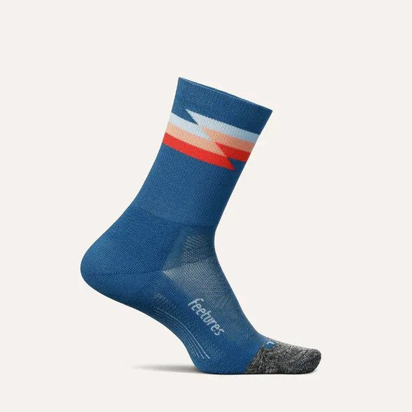 Blue sock with colorful stripe on a light gray background