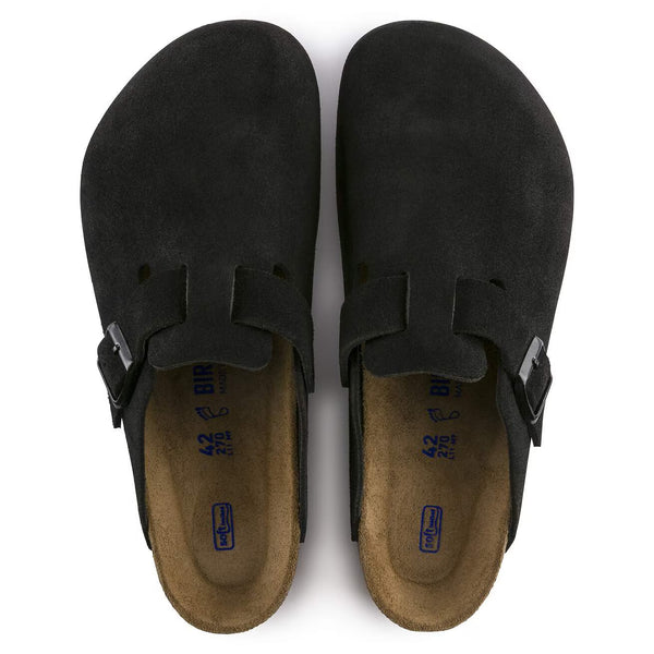 Black suede clog on a a white background
