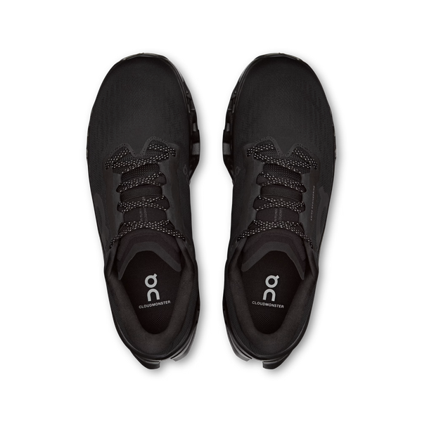 Black running shoes with brand logo on a white background