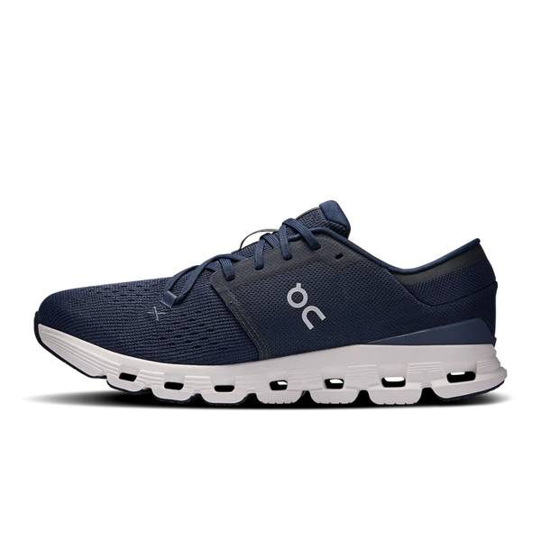 Navy and white athletic shoe on a white background