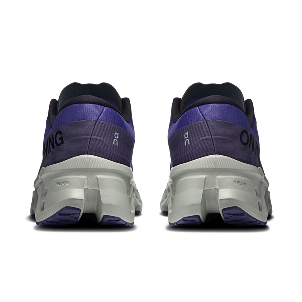 Back view of black and purple running shoes on a white background