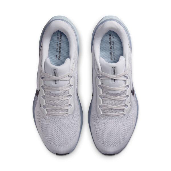 A pair of white running shoes on a white background.