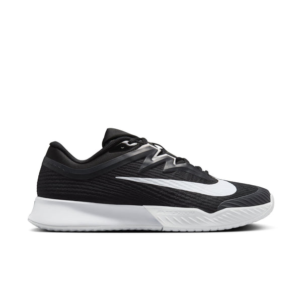 The lateral side of a mostly all black Nike tennis shoe.